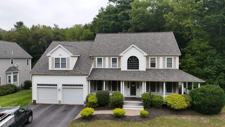 Beige colonial two car garage new roof