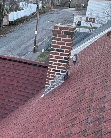 Brick chimney new flashing red roof