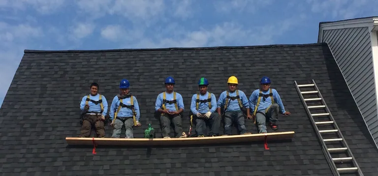 The LCT Construction & Services roofing crew on a completed shingle roof